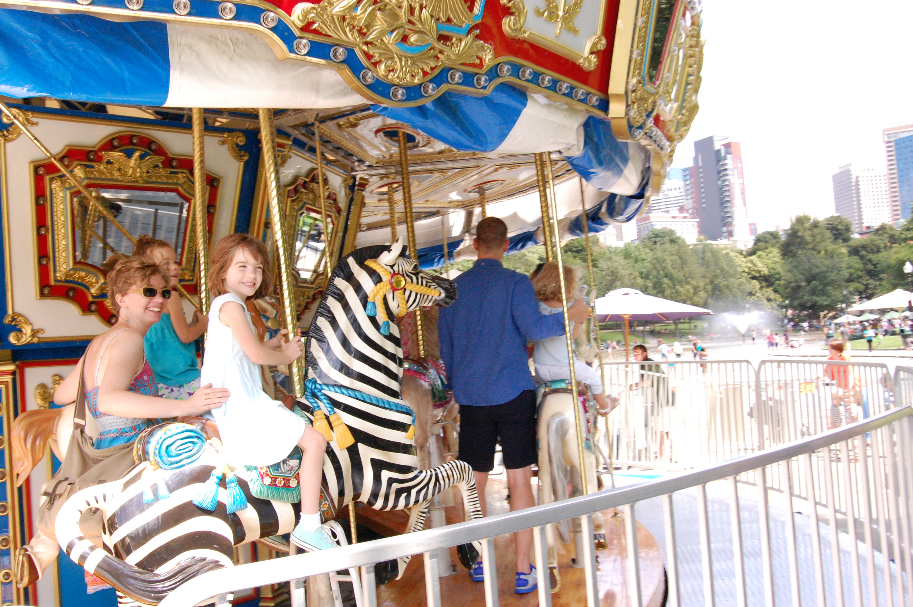 Riding the carousel at Boston Commons